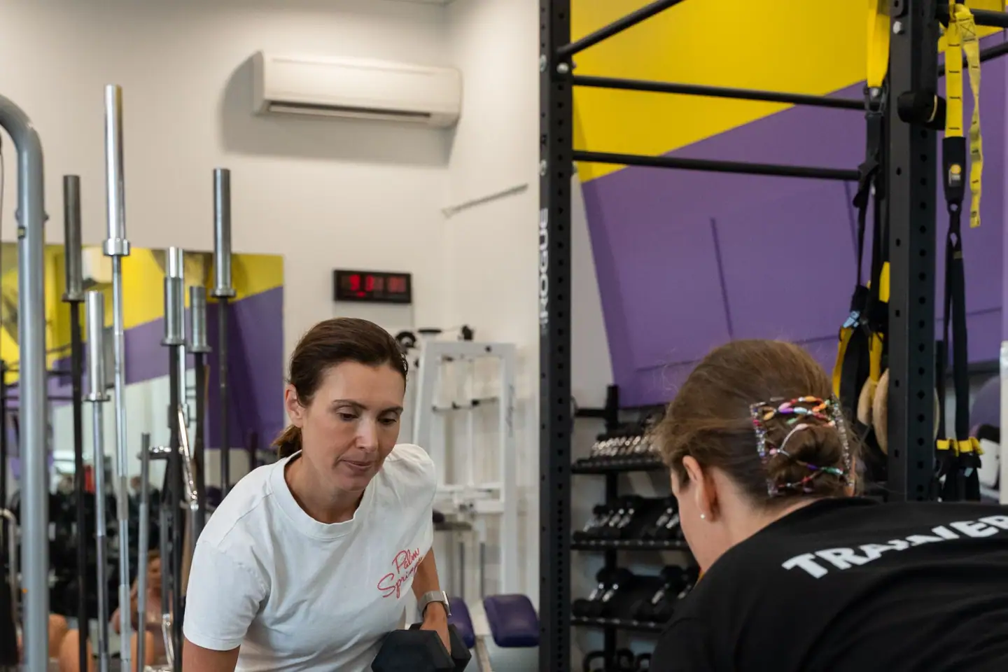 A trainer coaching a member at Body Shape Warringah Mall